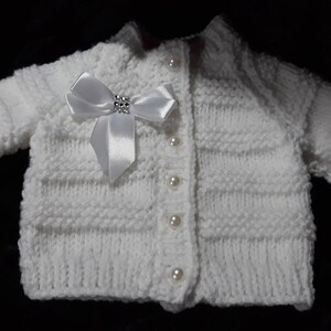 Baby clothing set includes Cardigan, hat and mitten set, hand knitted to order in sizes up to 12 months.