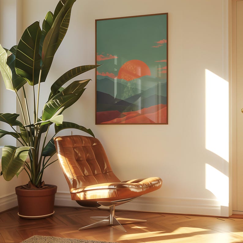 May include: A mid-century modern living room scene featuring a brown leather chair with a chrome base, a large potted plant, and a framed landscape art print with a sunset over mountains. The room has hardwood floors and a neutral wall color.