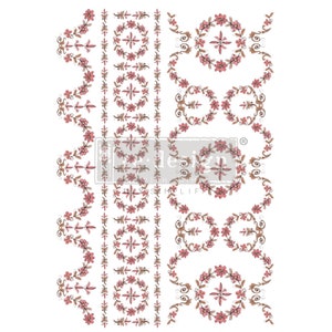 May include: Decorative floral transfer with pink flowers and brown accents on a white background. The design includes wreaths, vertical stripes, and wavy borders. The text "design with prima" is visible.