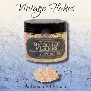 May include: A jar of metallic flakes for crafting. The jar is black with a gold label that reads "Metallic Flakes" and "Vintage". The jar is sitting on a blue and white textured surface.