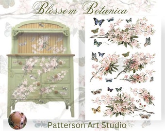 May include: A green painted antique hutch with a floral design featuring pink blossoms and butterflies. The hutch has a top shelf and three drawers. The image also includes a separate design sheet with floral branches and butterflies.