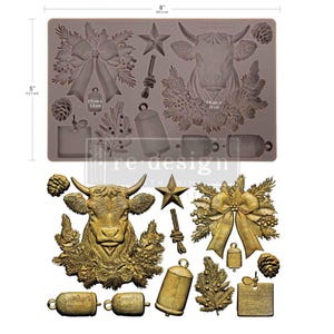 May include: A rectangular silicone mold measuring 8 inches by 5 inches, featuring cavities for a cow head with pine branches, a large bow, bells, a star, pinecones, and a square tag. Below, gold-colored castings show the finished shapes.