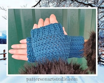 May include: A pair of blue crocheted fingerless gloves with a textured pattern. The gloves are shown against a green background.