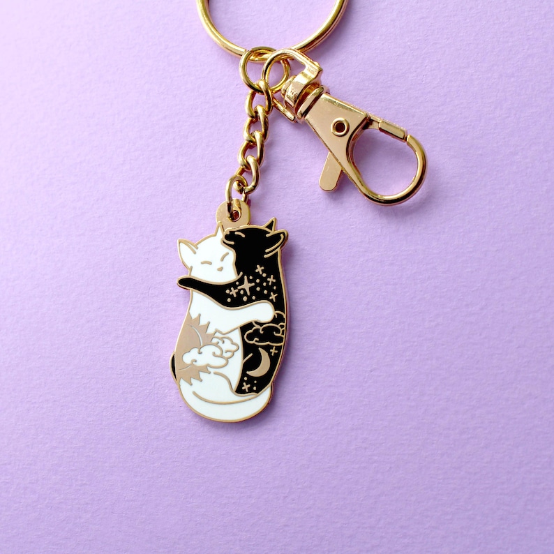 Day & night hugging cats keychain image 1