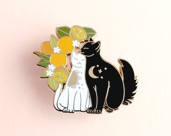 Snuggling cats enamel pin with oranges, Black and white hugging cats pin