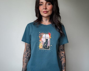 Women’s Window Cat T-shirt – women’s teal fall autumn cat looking out stormy window