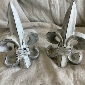 Two white distressed French fleur de lis bookends table decor