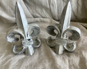 Two white distressed French fleur de lis bookends table decor
