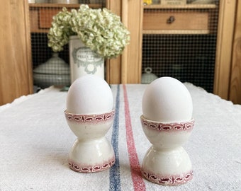 Beautiful vintage French ironstone egg cups in pinkish red