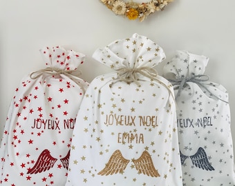 Christmas gift bag in personalized fabric. Reusable gift wrapping. Personalized Christmas hood, star fabric, Christmas decoration