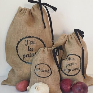 Burlap bags for potatoes, onions, garlic, and shallots. Kitchen storage. Food preservation. Kitchen decoration