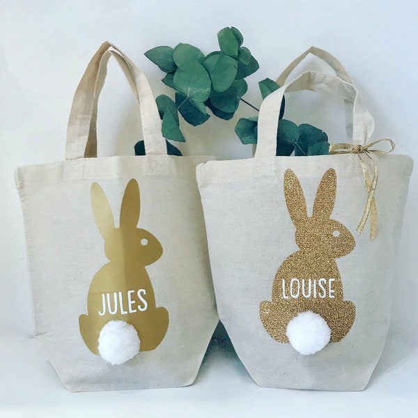 Sac, corbeille, ou panier de Pâques personnalisé pour les enfants. Sac écru, lapin doré, pompon blanc pour la chasse aux oeufs de Pâques.