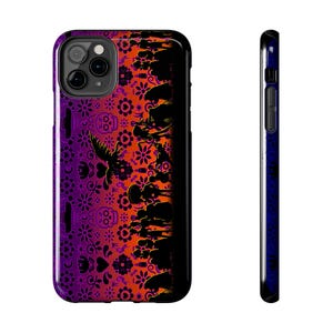May include: A black phone case with a colorful Day of the Dead design. The design features a gradient of orange, purple, and black with silhouettes of people and flowers.