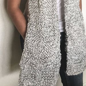 Pockets are on the side like in a coat.