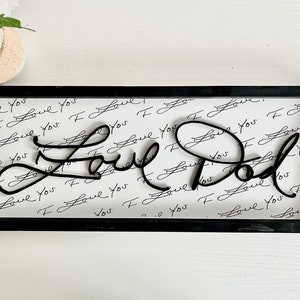 Letrero de recuerdo escrito a mano