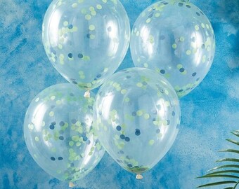 May include: Four clear balloons with green and blue confetti inside. The balloons are against a light blue background.