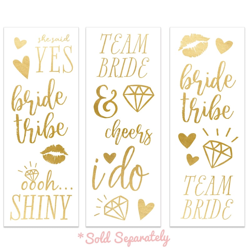 May include: Gold temporary tattoos with various phrases and designs, including "she said yes", "bride tribe", "team bride", "i do", "cheers", and "ooh shiny".