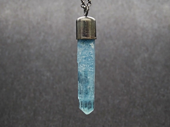 Aquamarine crystal best sale pendant