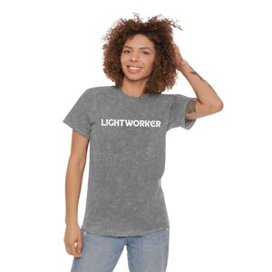 May include: A gray t-shirt with a white print that says "LIGHTWORKER".