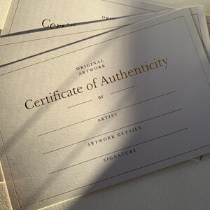 May include: A certificate of authenticity for original artwork. The certificate has spaces for the artist's name, artwork details, and signature.
