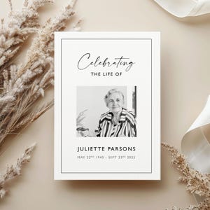 May include: A memorial card with a black border and the words "Celebrating the Life of" in elegant script. A black and white photo of a woman is centered below the text, with the name "Juliette Parsons" and dates below the photo.