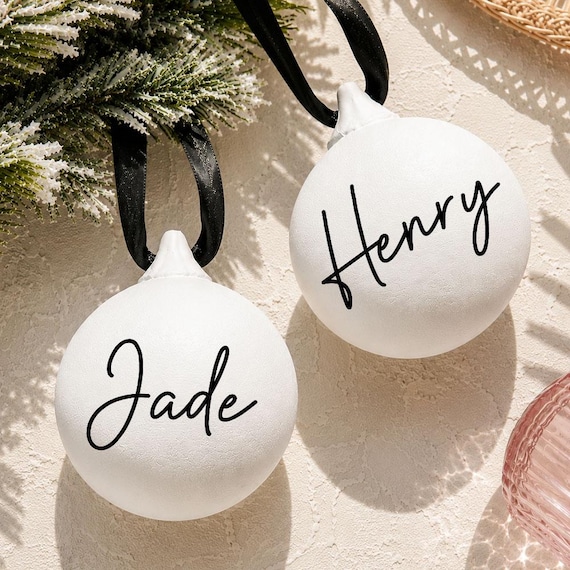 Hand-finished ceramic Christmas bauble you can personalise per family member — the kind of keepsake that survives 20 years of tree-decorating.