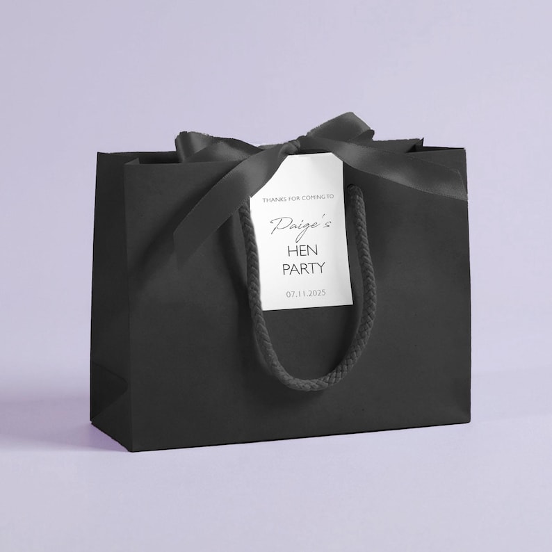 Personalised hen party gift bags with custom tags and ribbons, perfect for adding a special touch to hen do favours. Made from 100% recycled paper with reinforced bases and soft rope handles, these elegant bags can be customised with names, dates, or messages. Ideal for presenting gifts or party favours in style.