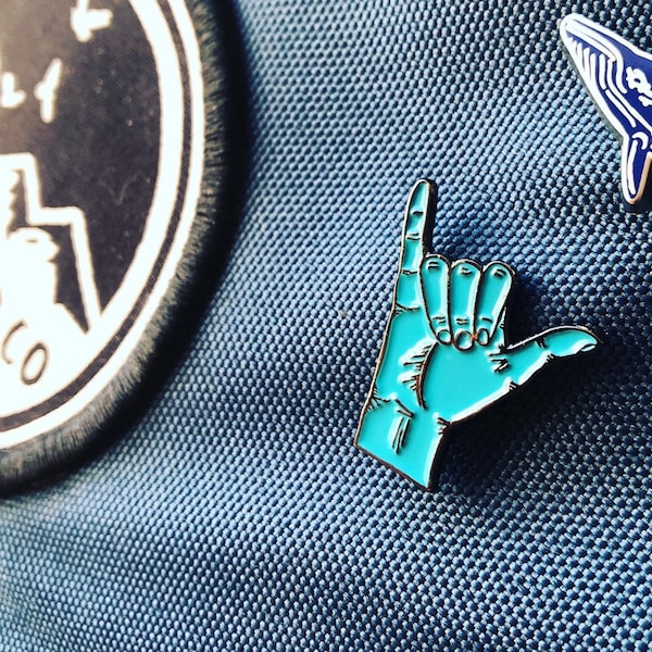 Shaka soft enamel pin badge.