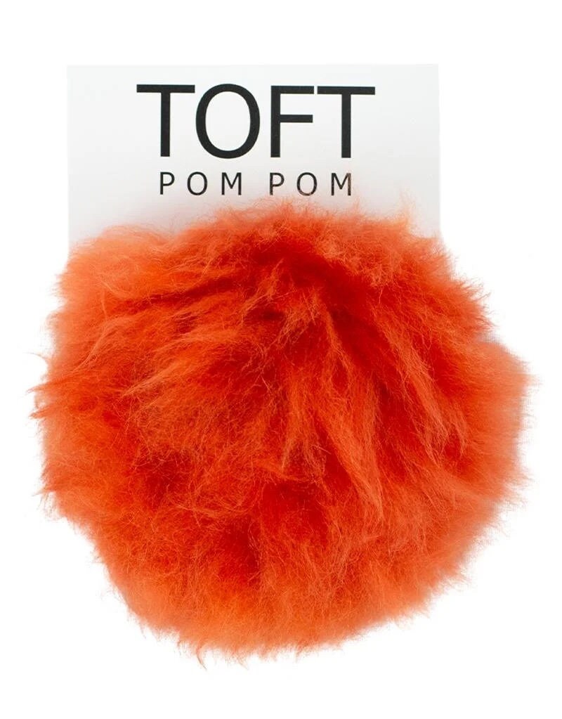 Choose a Colorful Toft Pom Pom made from Alpaca Fur which has a snap to sew  on to your knitwear. Snap on and off for washing or to change the look  of