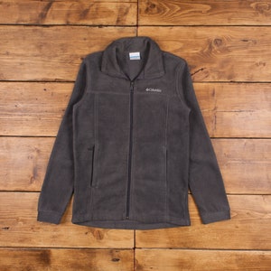 May include: A dark gray fleece jacket with a zipper closure and a Columbia logo on the chest.