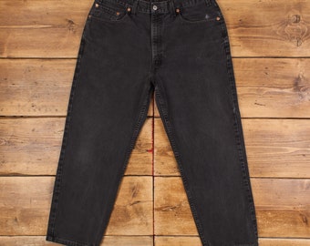 Jean Levis 550 vintage 35 x 27 USA fabriqué des années 90 délavé foncé fuselé noir rouge