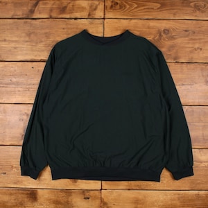 May include: A dark green long-sleeved pullover sweatshirt with a ribbed crew neck and cuffs.