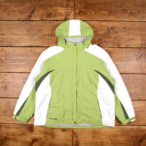 May include: A green and white hooded jacket with a zip fastening and the Columbia logo on the front.