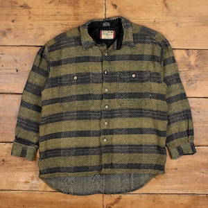 May include: A button-down shirt with a green and black striped pattern. The shirt has two chest pockets and a collar. The label reads "Ivy Crew". The shirt is made of a textured fabric.