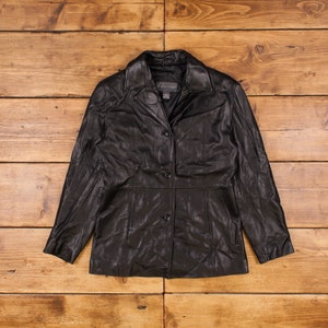 May include: A black leather jacket with a button closure and a collar. The jacket has a slightly fitted silhouette.