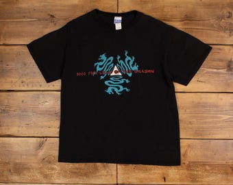 May include: Black t-shirt with a blue and red graphic of three dragons surrounding a triangle with the text "2000 THE LEGEND OF THE DRAGON"
