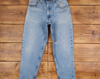 Jean Levis 560 vintage 33 x 30 USA fabriqué des années 90 délavé à la pierre conique bleu rouge