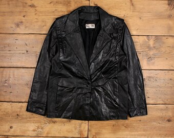 May include: A black leather blazer with a single button closure and a label that reads "G-III".