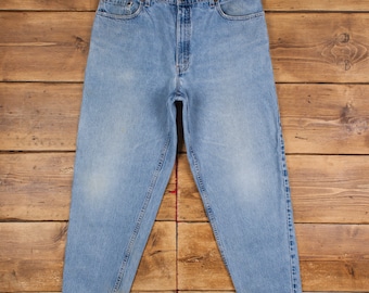 Jean Levis 560 vintage 38 x 30 USA fabriqué des années 90 délavé à la pierre conique bleu rouge