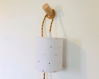 Walking lamp with the white double gauze fabric with golden polka dots, ideal as a bedside lamp.