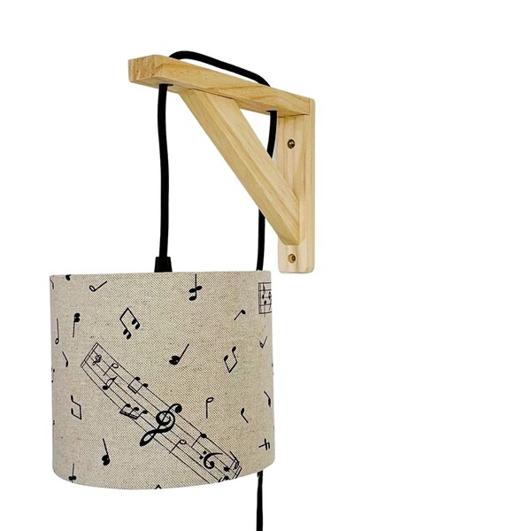 Lampe équerre avec un tissu beige et des notes de musique noires