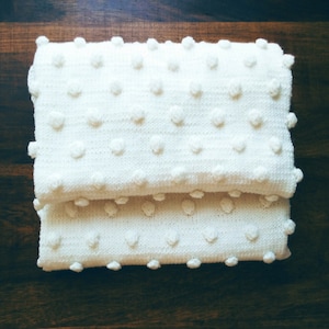 Hand knit merino wool baby blanket.