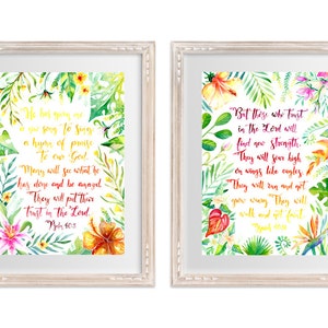 May include: Two framed watercolour prints with tropical floral designs and inspirational bible verses. The first print features the verse "He has given me a new song to sing, a hymn of praise to our God. Many will see what he has done and be amazed. They will put their trust in the Lord." Psalm 40:3. The second print features the verse "But those who trust in the Lord will find new strength. They will soar high on wings like eagles. They will run and not grow weary; they will walk and not faint." Isaiah 40:31.