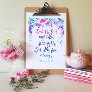 May include: A watercolor print with a floral border and the text "Seek the Lord and His Strength: Seek His face always" with the scripture reference "1 Chronicles 16:11".