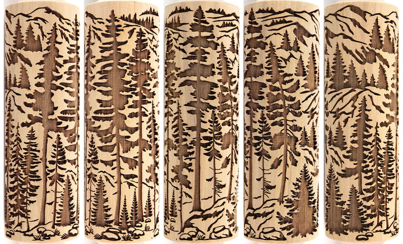 May include: A set of five wooden rolling pins with a carved forest scene. The design features tall pine trees, mountains, and rocks. The wood has a natural, light brown color, and the carved details are dark brown.