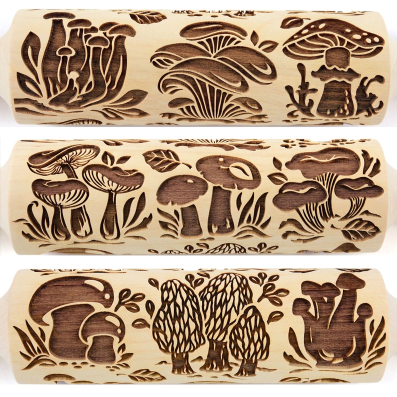 May include: A wooden rolling pin with a carved design of mushrooms and leaves. The rolling pin is approximately 10 inches long and has a light brown color.
