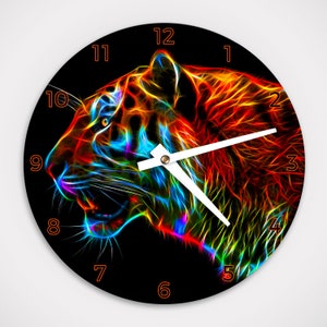 May include: A round clock with a black background and a neon tiger design. The tiger is made up of bright colors, including red, orange, yellow, green, blue, and purple. The clock face has orange numbers and white hands.