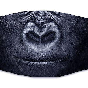 May include: A black and white face mask with a close-up image of a gorilla's nose and mouth.