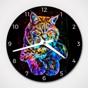 May include: A black clock face with white numbers and hands. The clock face features a colorful, abstract image of a bobcat with neon-like colors.