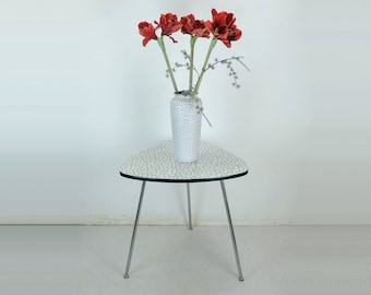 1950s three-legged COFFEE TABLE with formica top and slanted chrome legs